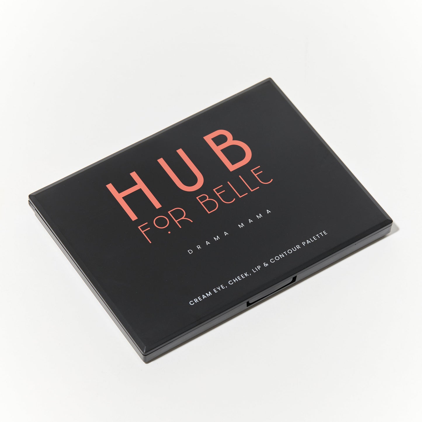 Hub for Belle cream Drama Mama all in one makeup palette closed and containing bronzer, blush, eyeshadow, concealer and highlighter creams