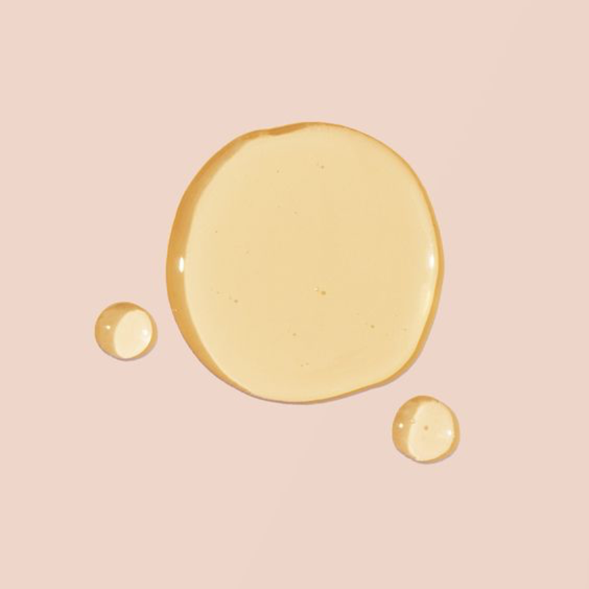 Three droplets of Coenzyme Q10 on a pink background