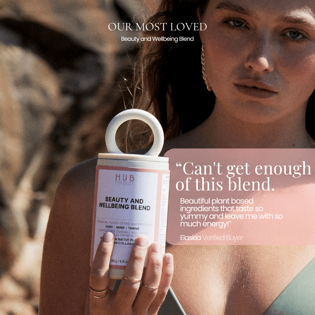 A woman outdoors holds a white tub of HUB for belle Beauty and Wellbeing Blend. The image features a pink overlay with customer testimonials and the text 'OUR MOST LOVED Beauty and Wellbeing Blend'.