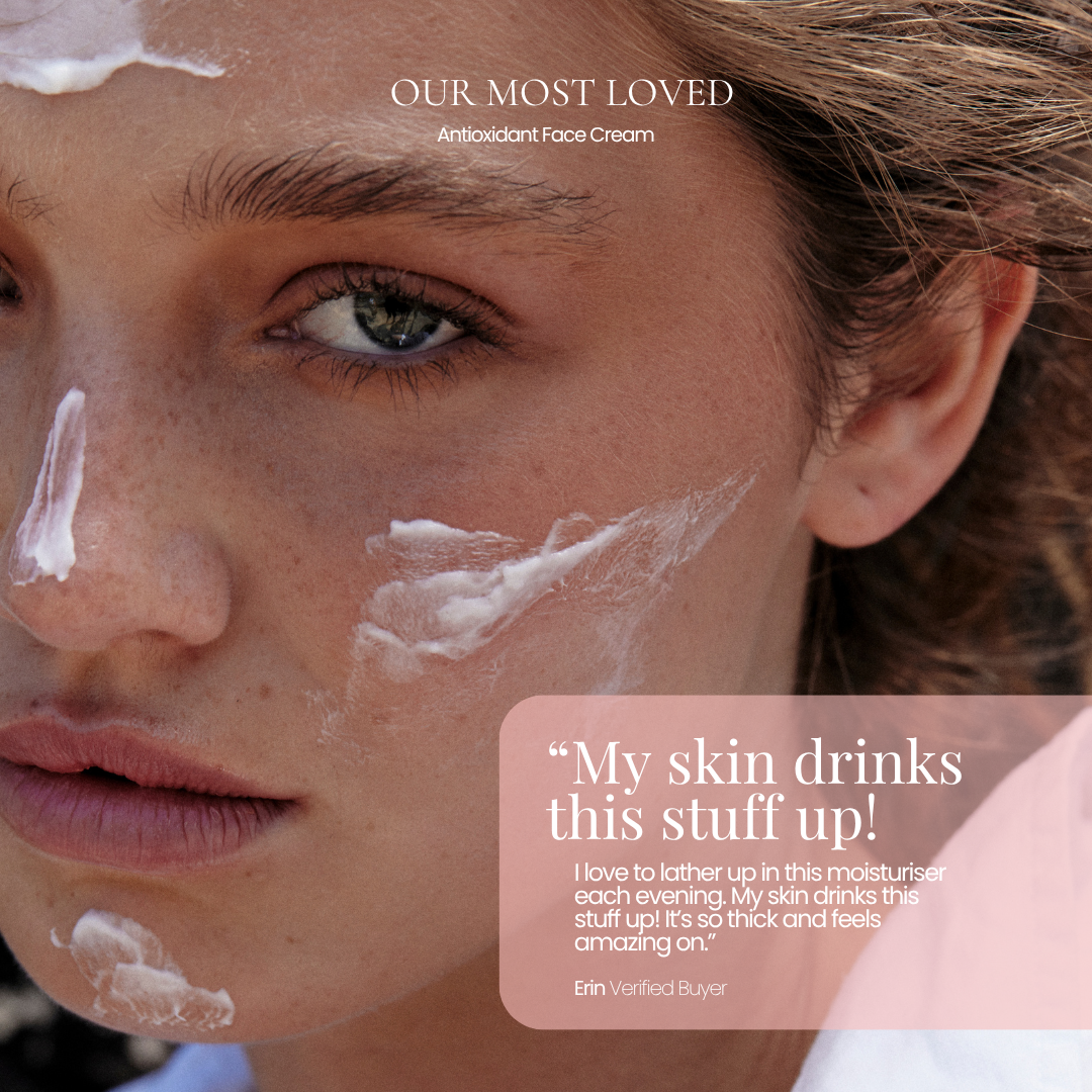 Close-up of a woman's face with white face cream smeared across her forehead, nose, cheeks, and chin. Text at the top reads 'OUR MOST LOVED Antioxidant Face Cream by Hub for belle,' and a translucent pink box on the lower right contains a customer review quote attributed to Elin Verified Buyer.