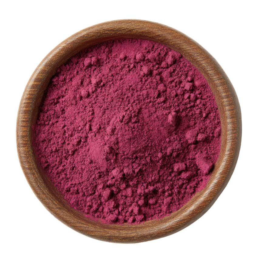 Wooden bowl filled with pink beetroot powder on a white background