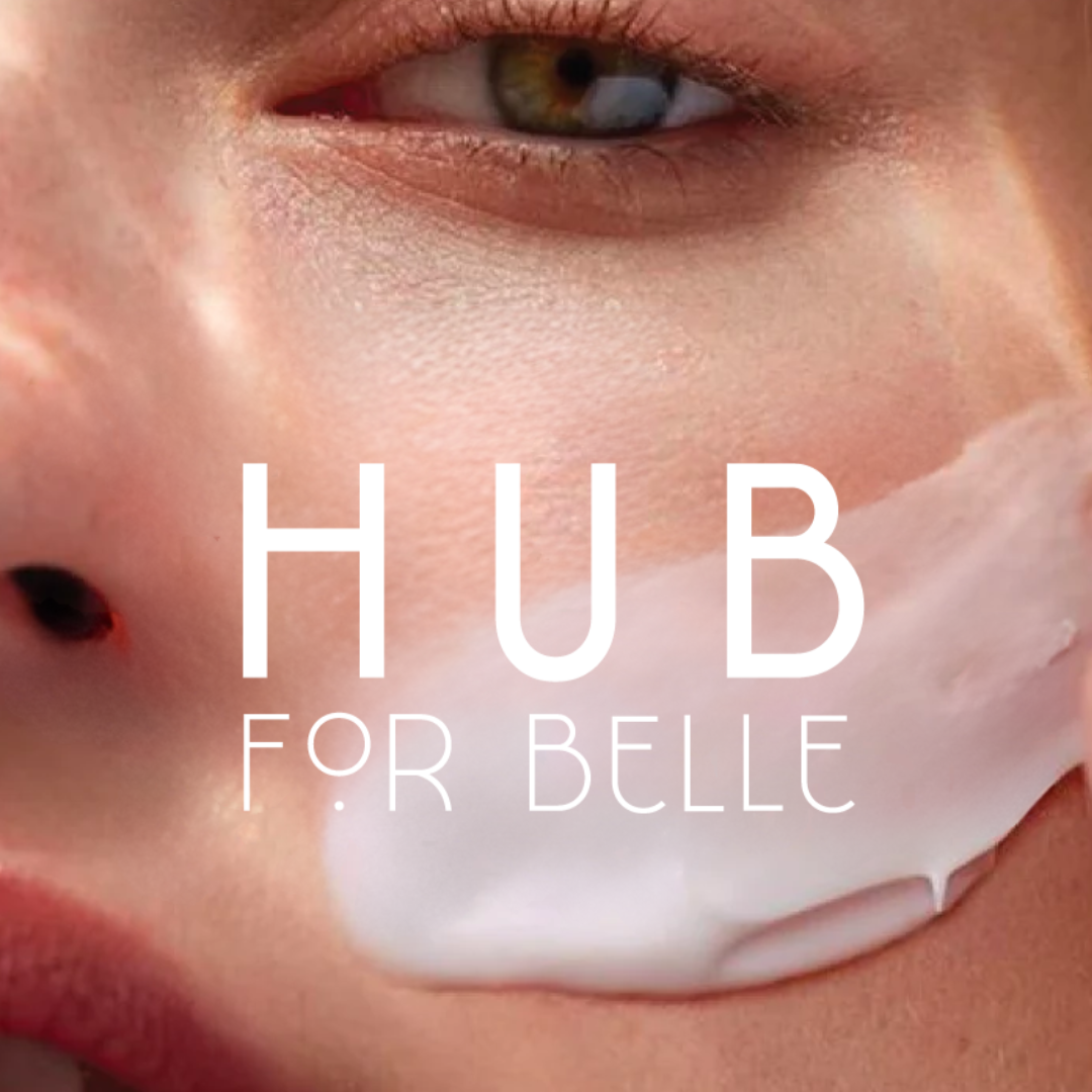 Hub for Belle natural vegan skincare and haircare logo on face of model with moisturiser on cheek