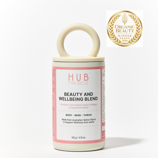A cylindrical supplement jar with a cream-colored handle and a pink-and-white label reading 'HUB FOR BELLE BEAUTY AND WELLBEING BLEND.' A gold Organic Beauty Winner 2026 badge appears in the top right on a clean white background.