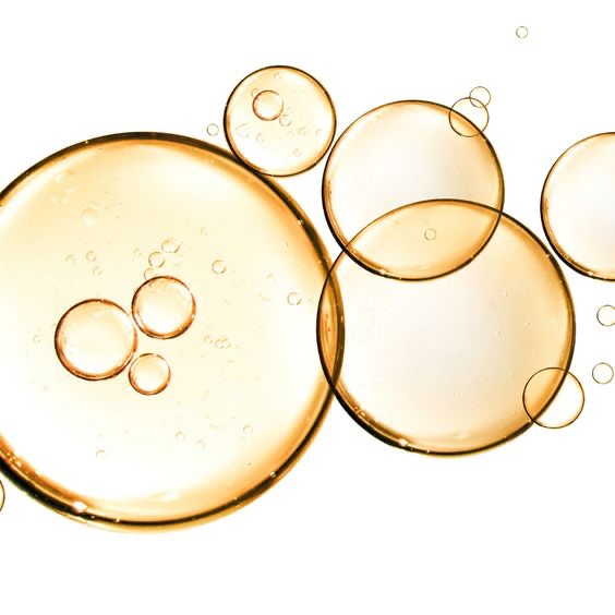 Vitamin E Gold bubbles on a white background