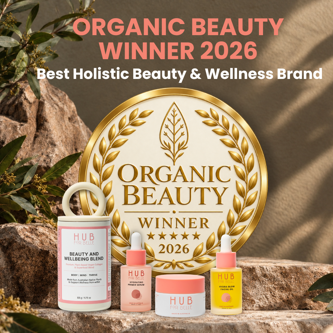 Hub for Belle 2026 Organic Beauty winner for the Best Holistic Beauty and Wellness Brand picture with award and skincare and Inner wellness range on a
rock with foliage.