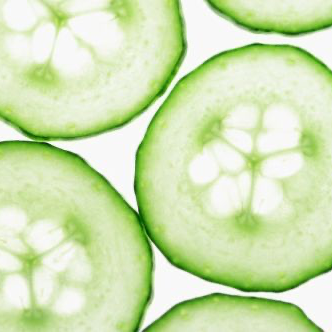 Sliced cucumbers arranged in a pattern on a white background